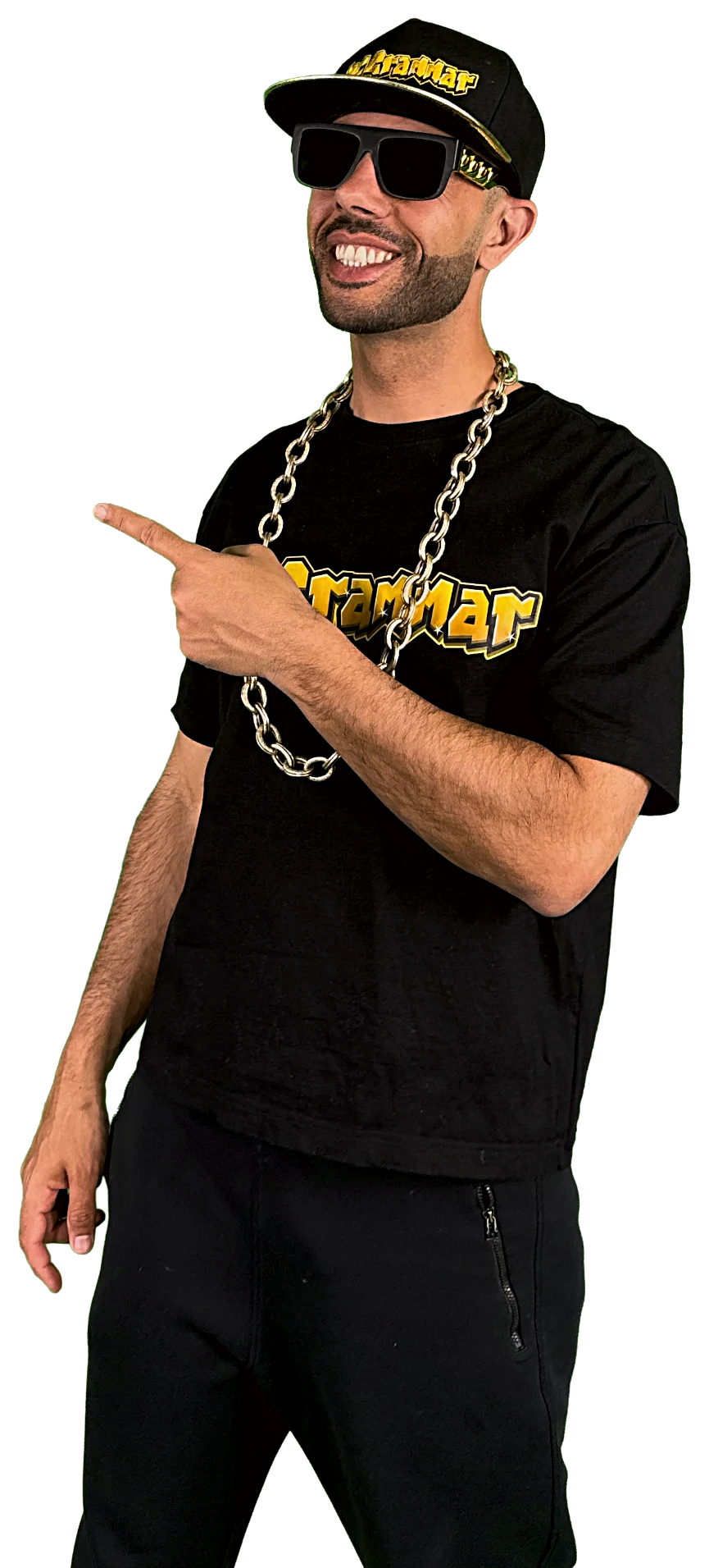MC Grammar in the cap, shades and chain, smiling and pointing